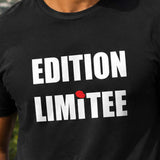 Homme portant un t-shirt noir avec le design « Edition Limitée » devant un panorama montagneux de l'île de La Réunion.